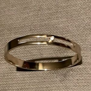 Gold bracelet with dainty jewel